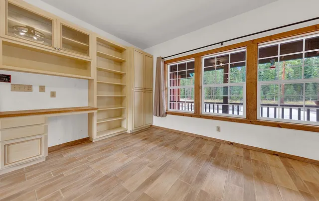 a view of a kitchen with a sink cabinet cabinets and a living room