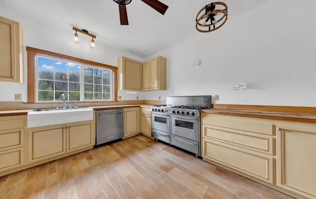 a kitchen with a stove and a refrigerator