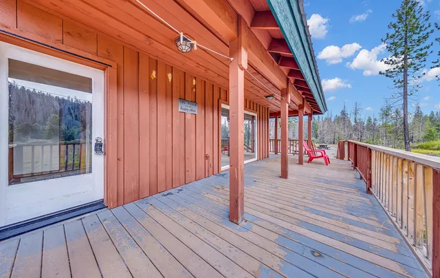 a view of a street with wooden fence