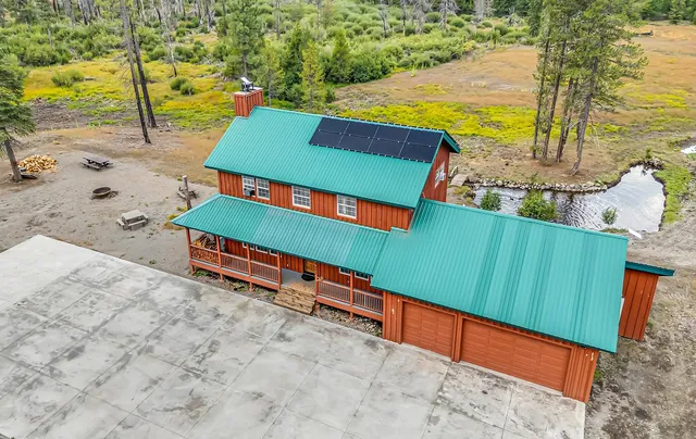 an aerial view of residential houses with outdoor space