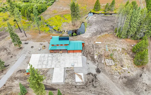 a view of aerial view of residential houses with outdoor space and trees