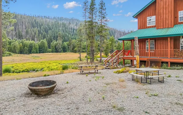 a view of a park with iron fence