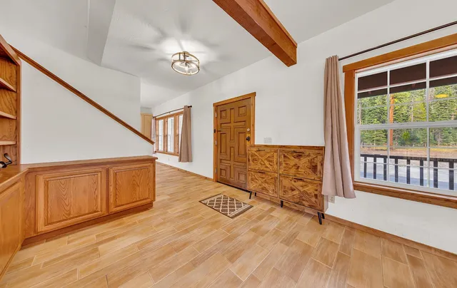 a view of a dining room with furniture window and wooden floor