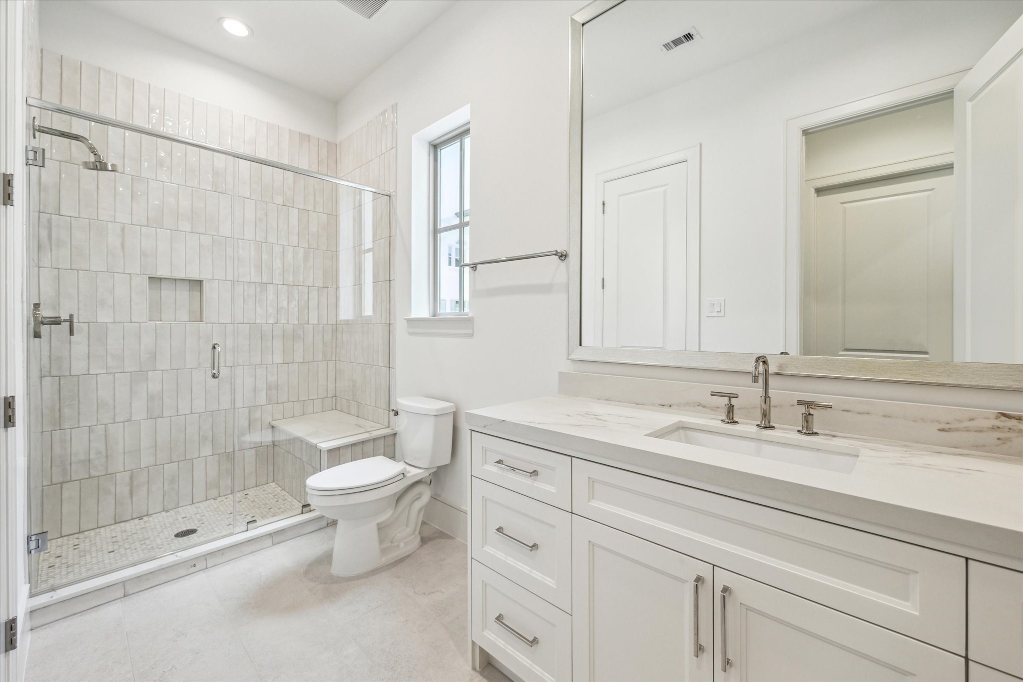209 Sutton Row Place Houston, TX 77024 - Photo 13 of 23 Full bath off secondary features glass enclosed shower with seat.