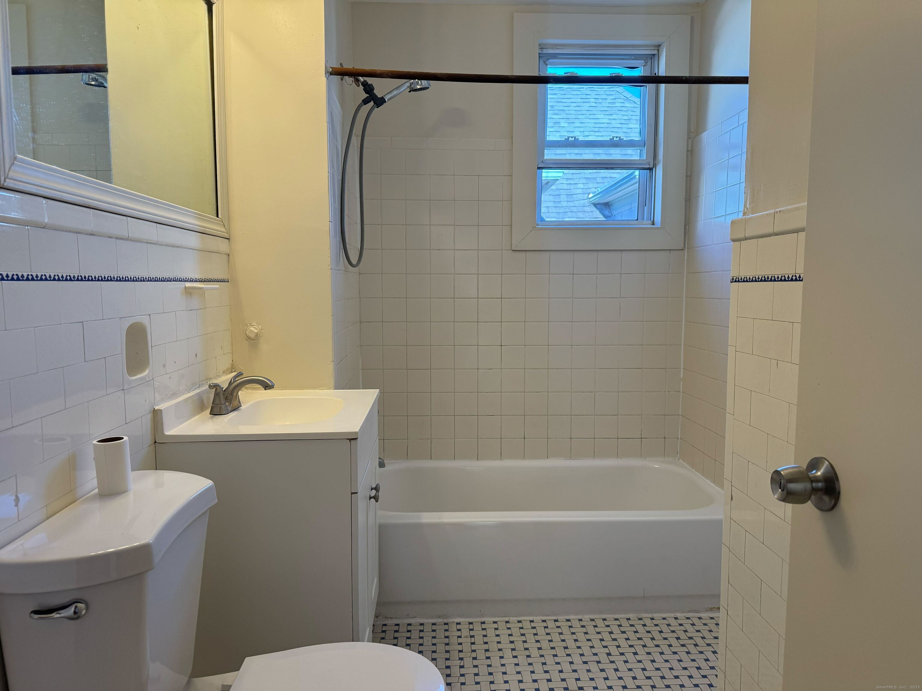 461 Howard Avenue, Unit 3 New Haven, CT 06519 - Photo 11 of 11 a bathroom with a sink a mirror toilet and bathtub