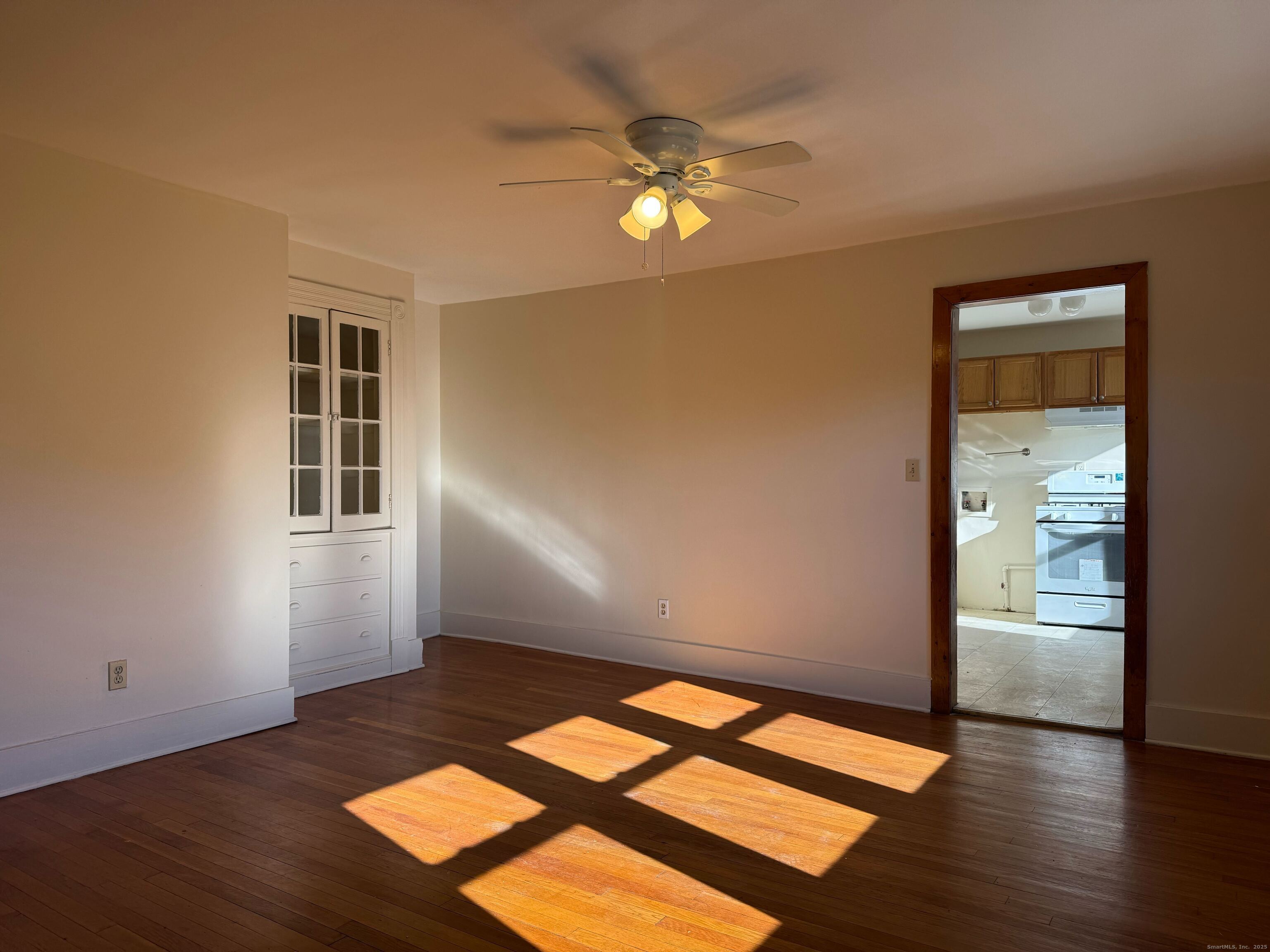 461 Howard Avenue, Unit 3 New Haven, CT 06519 - Photo 5 of 11 a view of empty room with wooden floor