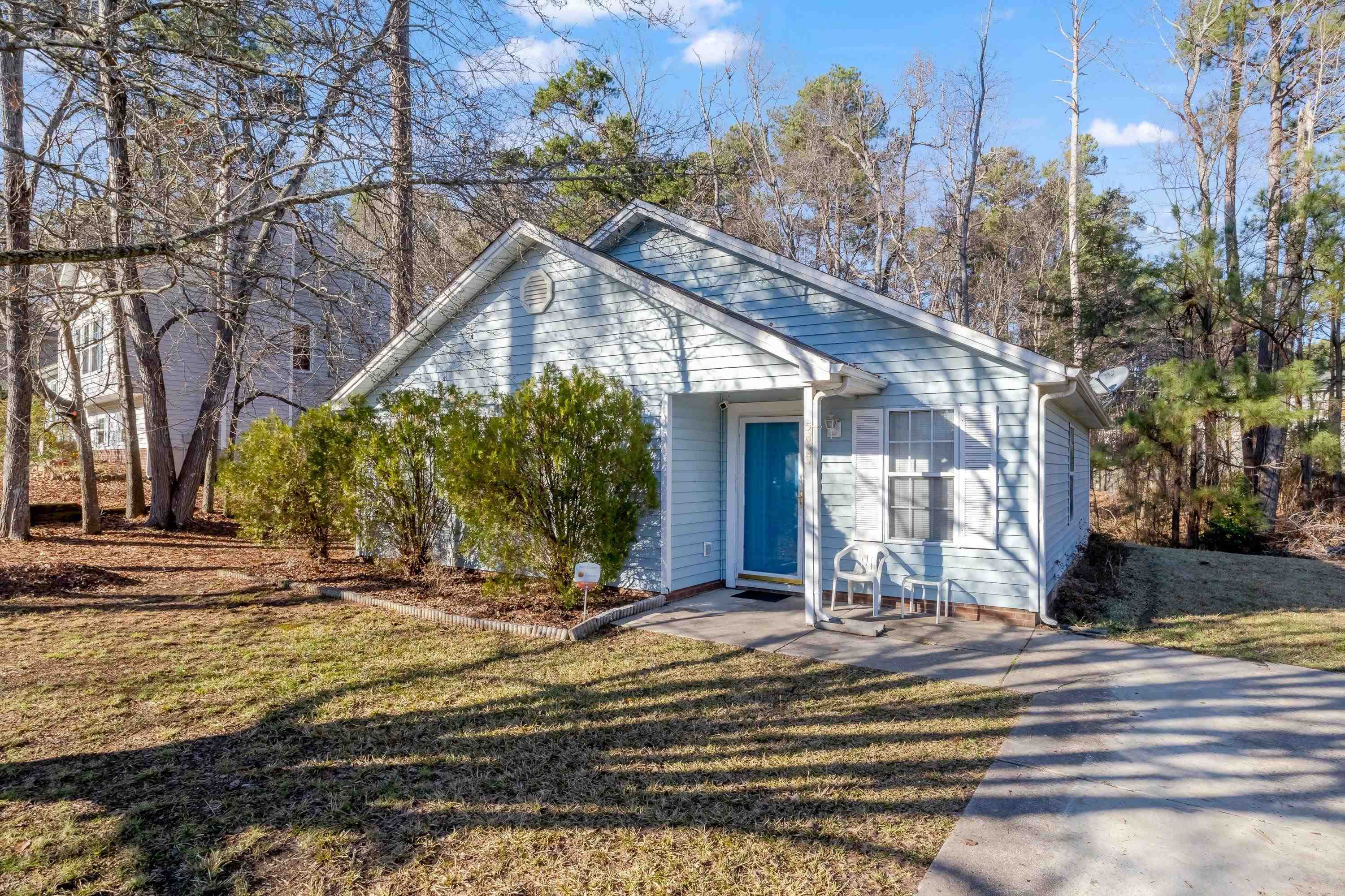 5823 Hadrian Drive Durham, NC 27703 - Photo 1 of 20 a view of a house with snow on the side of it