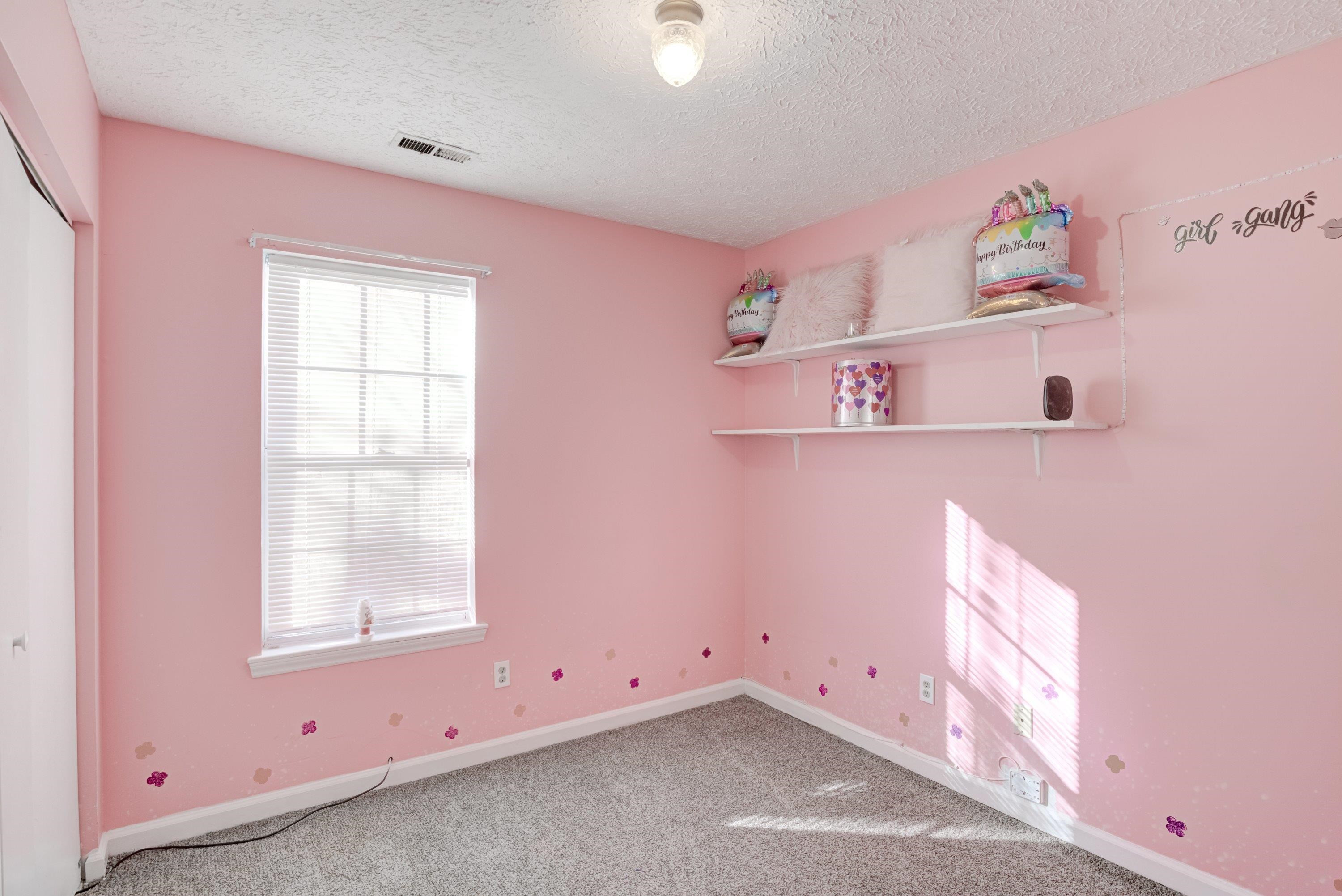 5823 Hadrian Drive Durham, NC 27703 - Photo 11 of 20 an empty room with windows