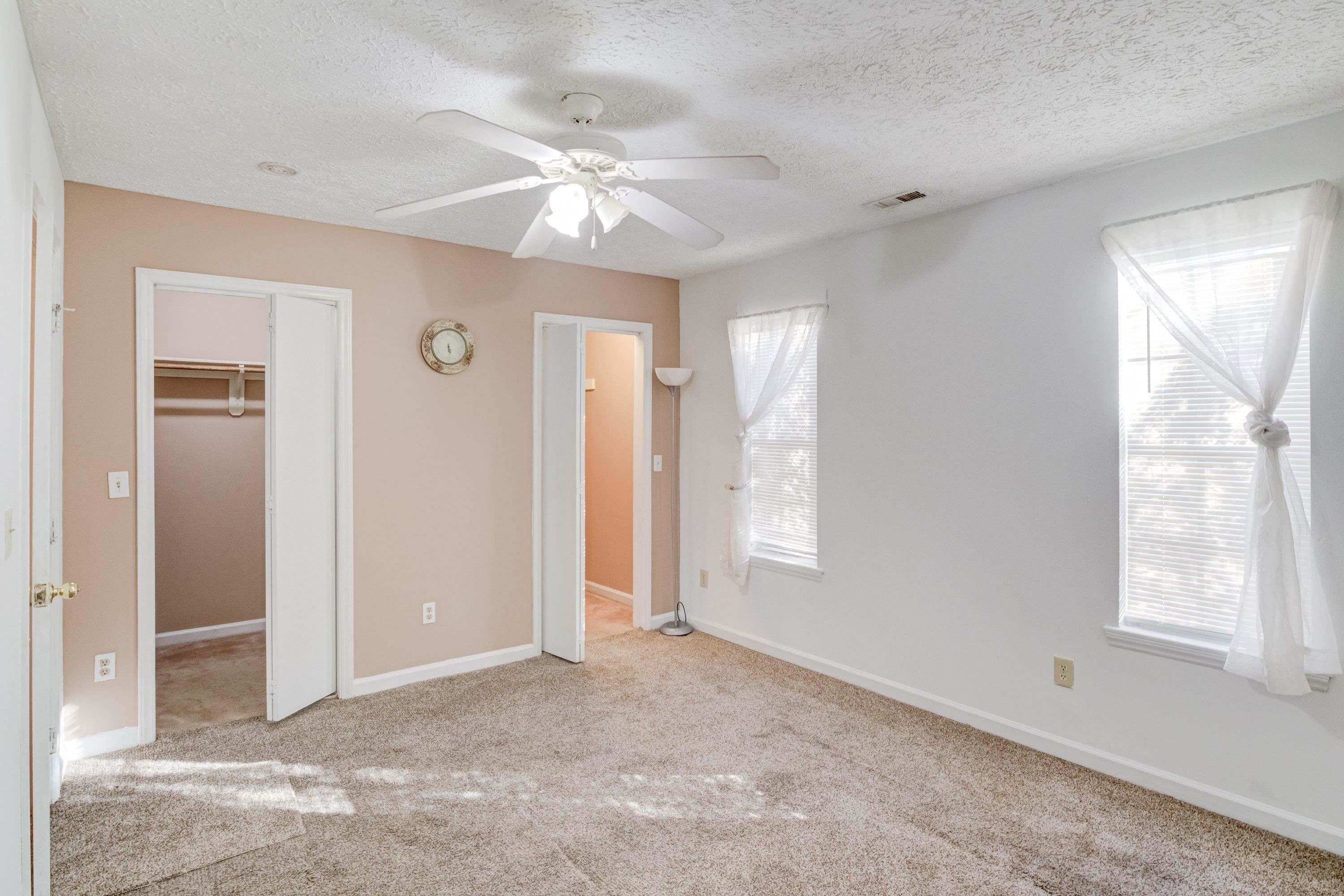 5823 Hadrian Drive Durham, NC 27703 - Photo 16 of 20 a view of an empty room with window and chandelier fan