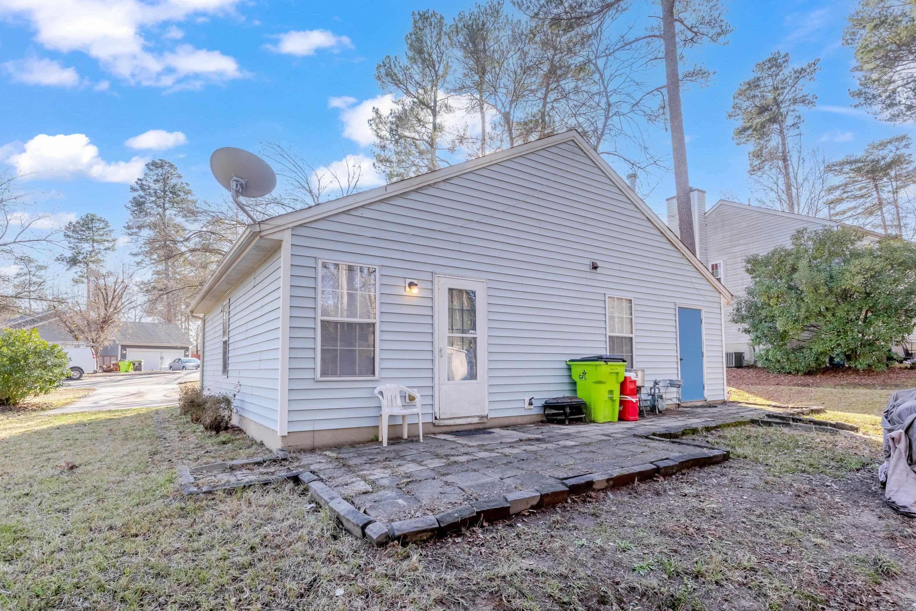 5823 Hadrian Drive Durham, NC 27703 - Photo 17 of 20 a view of back yard of the house