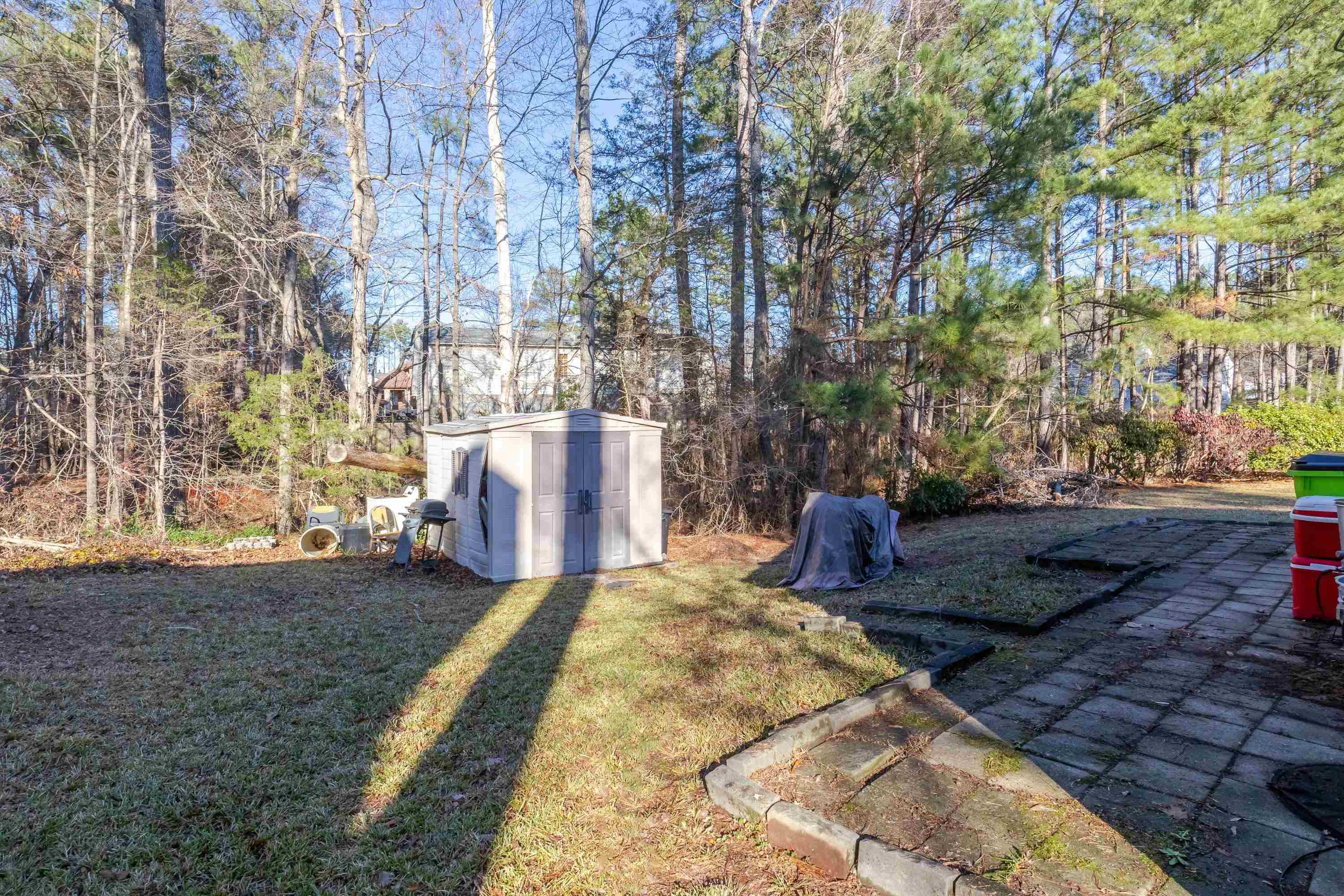 5823 Hadrian Drive Durham, NC 27703 - Photo 19 of 20 a view of a backyard with large trees