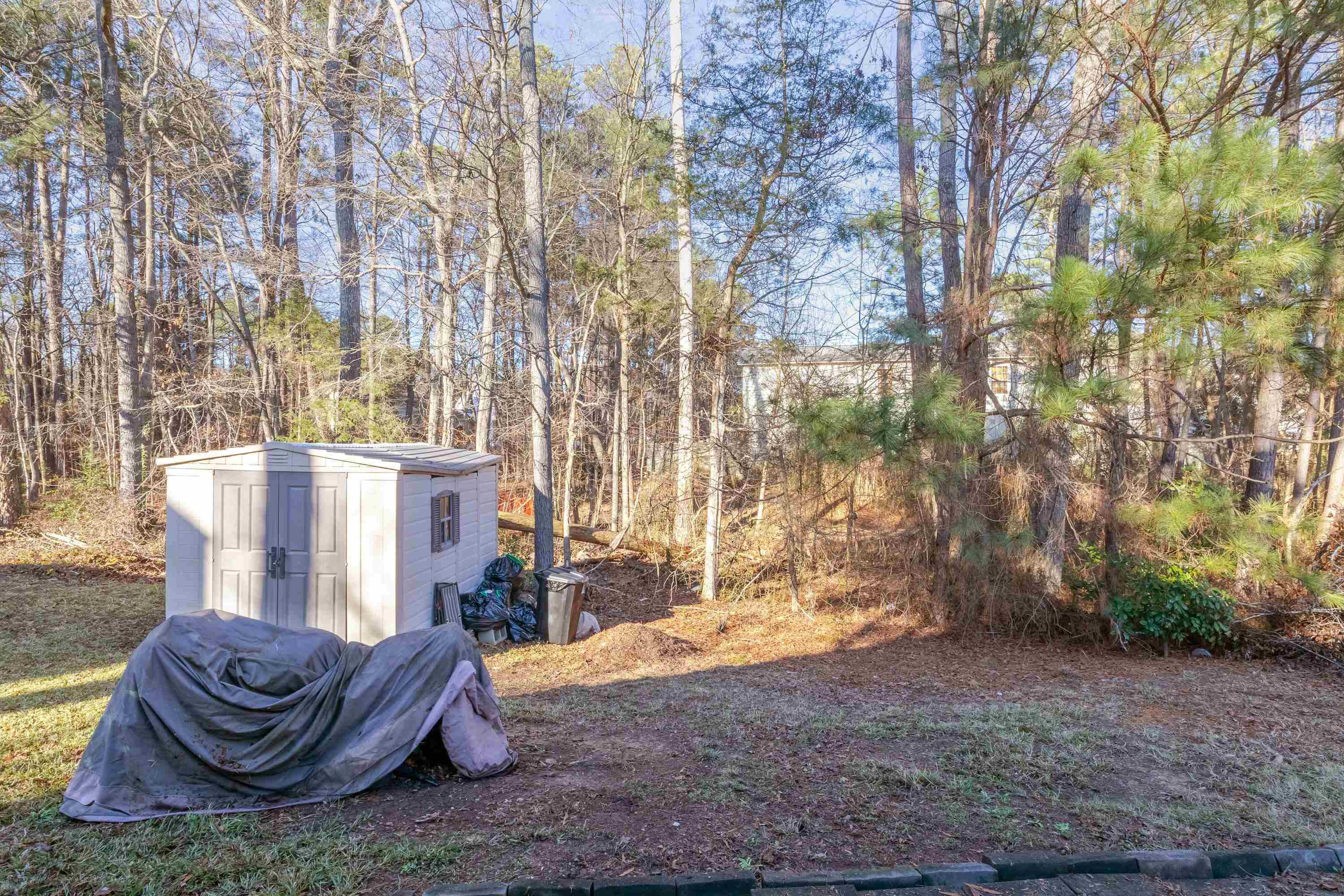 5823 Hadrian Drive Durham, NC 27703 - Photo 20 of 20 a view of patio with couches and a table and chairs