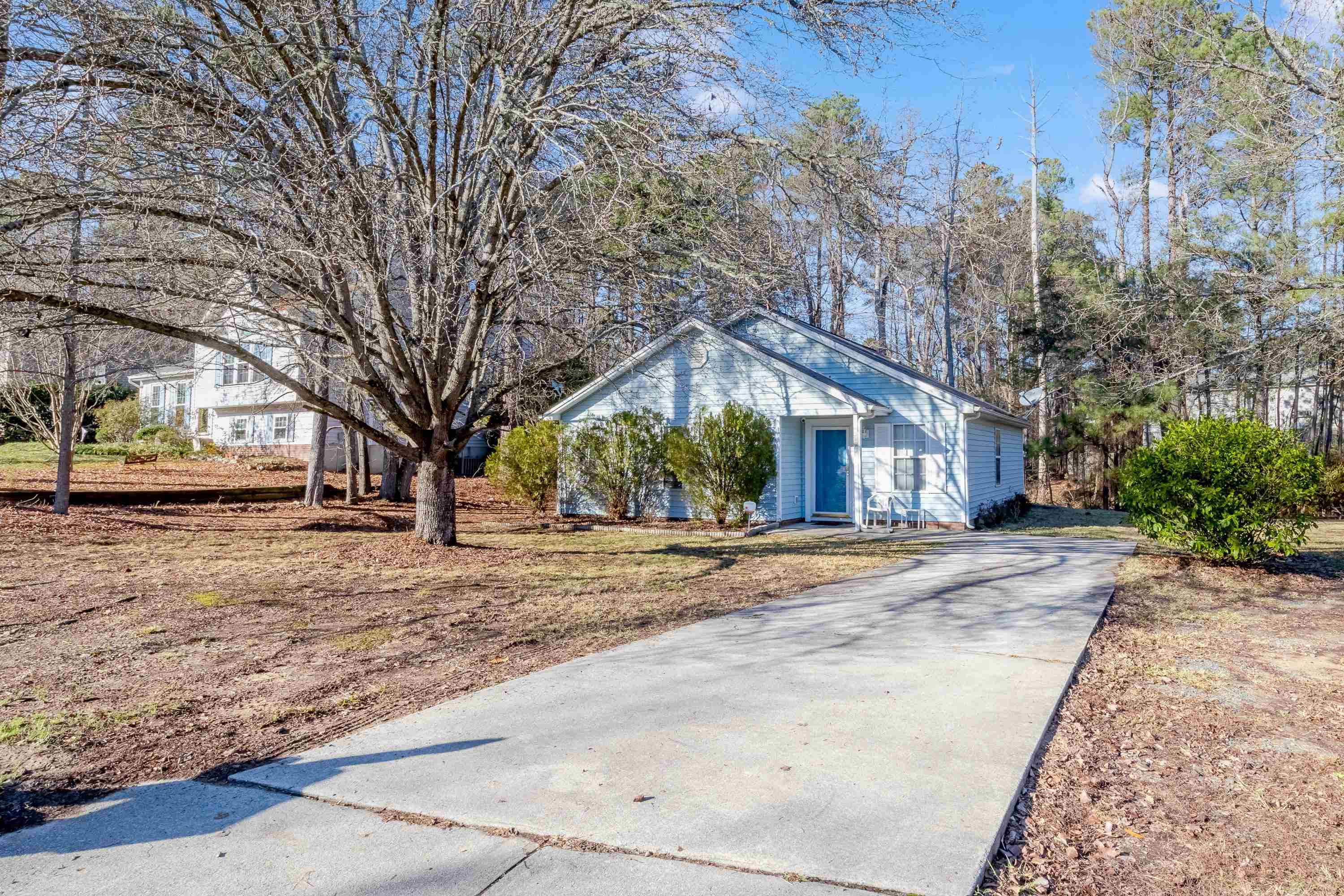 5823 Hadrian Drive Durham, NC 27703 - Photo 3 of 20 a view of a house with snow on the road