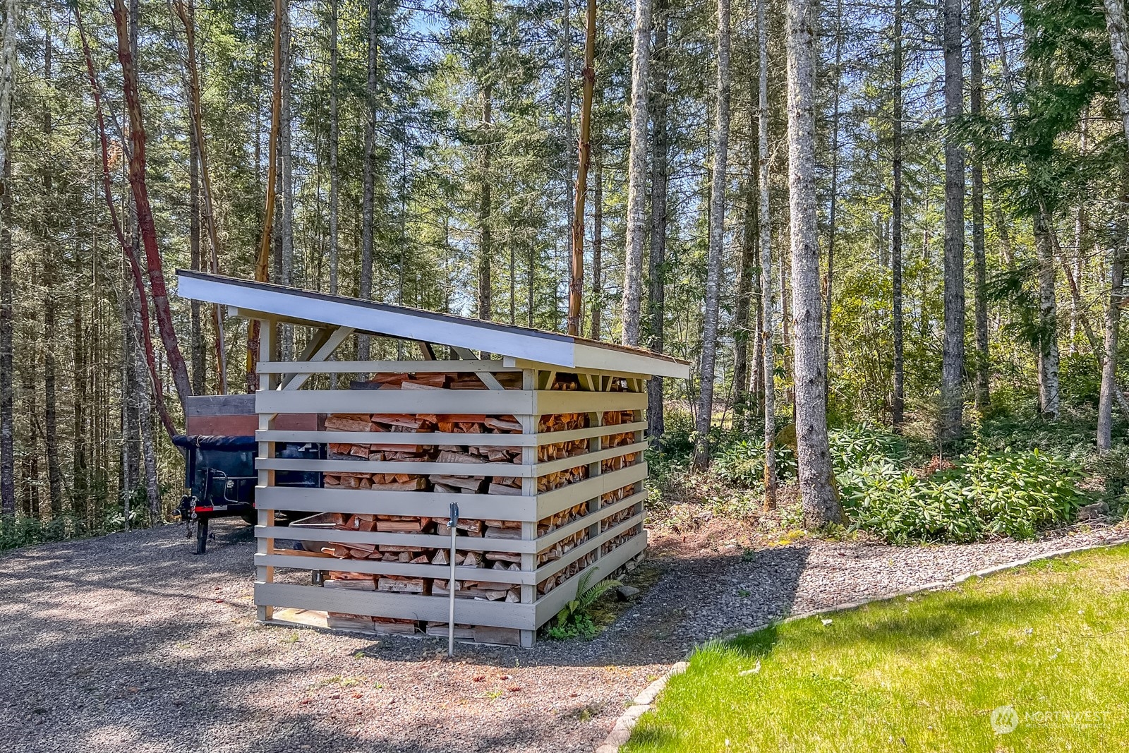 685 Misty Ridge Road Port Townsend, WA 98368 - Photo 13 of 39 a view of a swimming pool with a yard