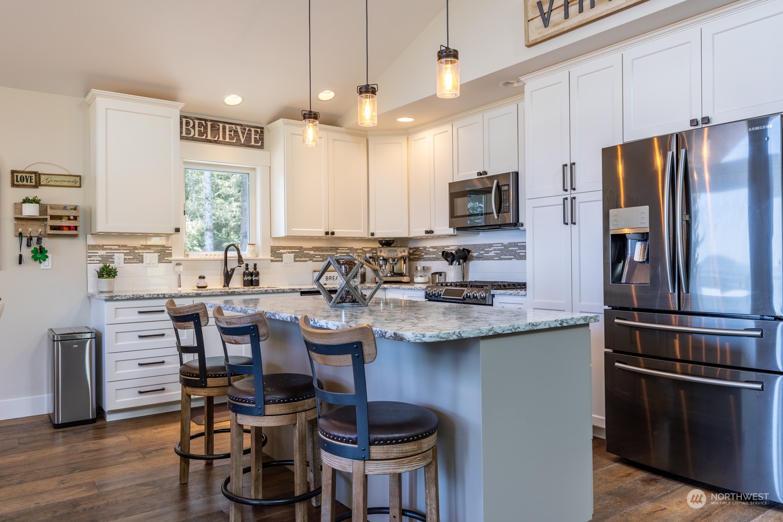 685 Misty Ridge Road Port Townsend, WA 98368 - Photo 18 of 39 a kitchen with a sink cabinets and stainless steel appliances