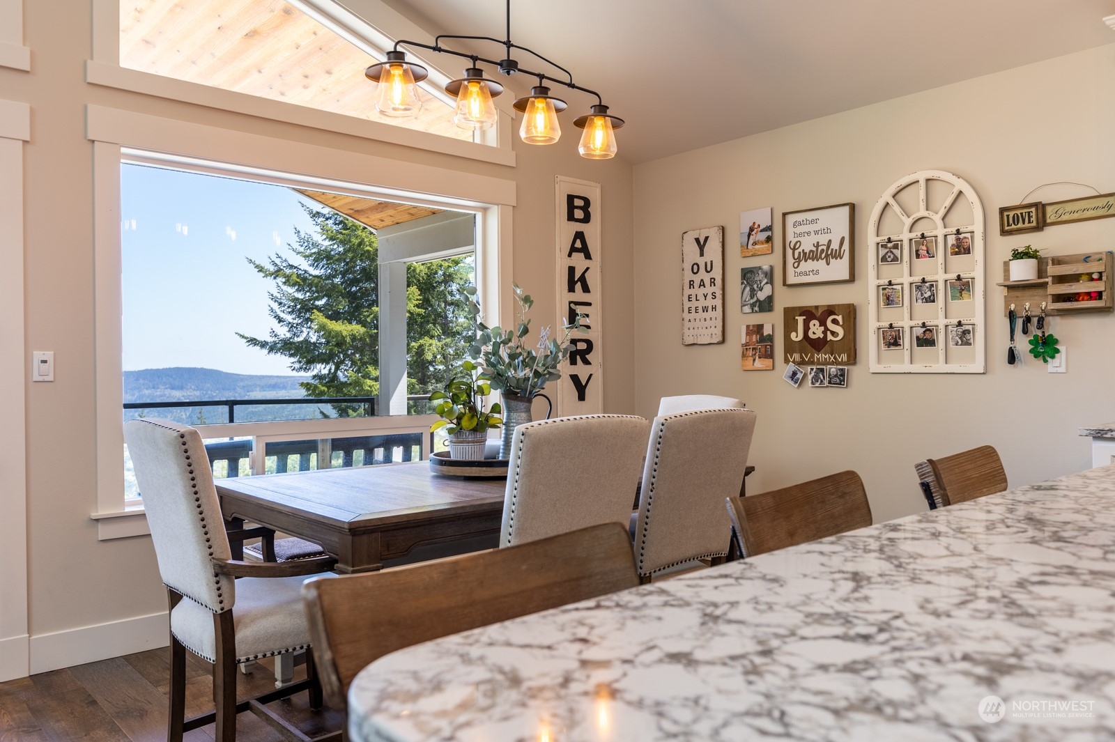 685 Misty Ridge Road Port Townsend, WA 98368 - Photo 19 of 39 a view of a dining room with furniture window and outside view
