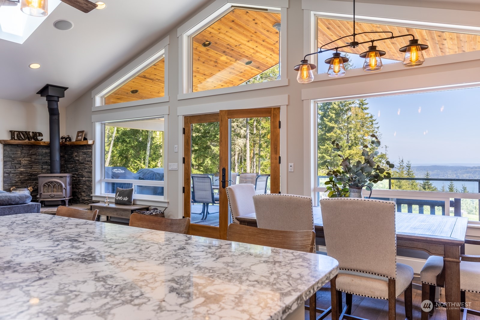 685 Misty Ridge Road Port Townsend, WA 98368 - Photo 20 of 39 a view of a dining room with furniture window and outside view