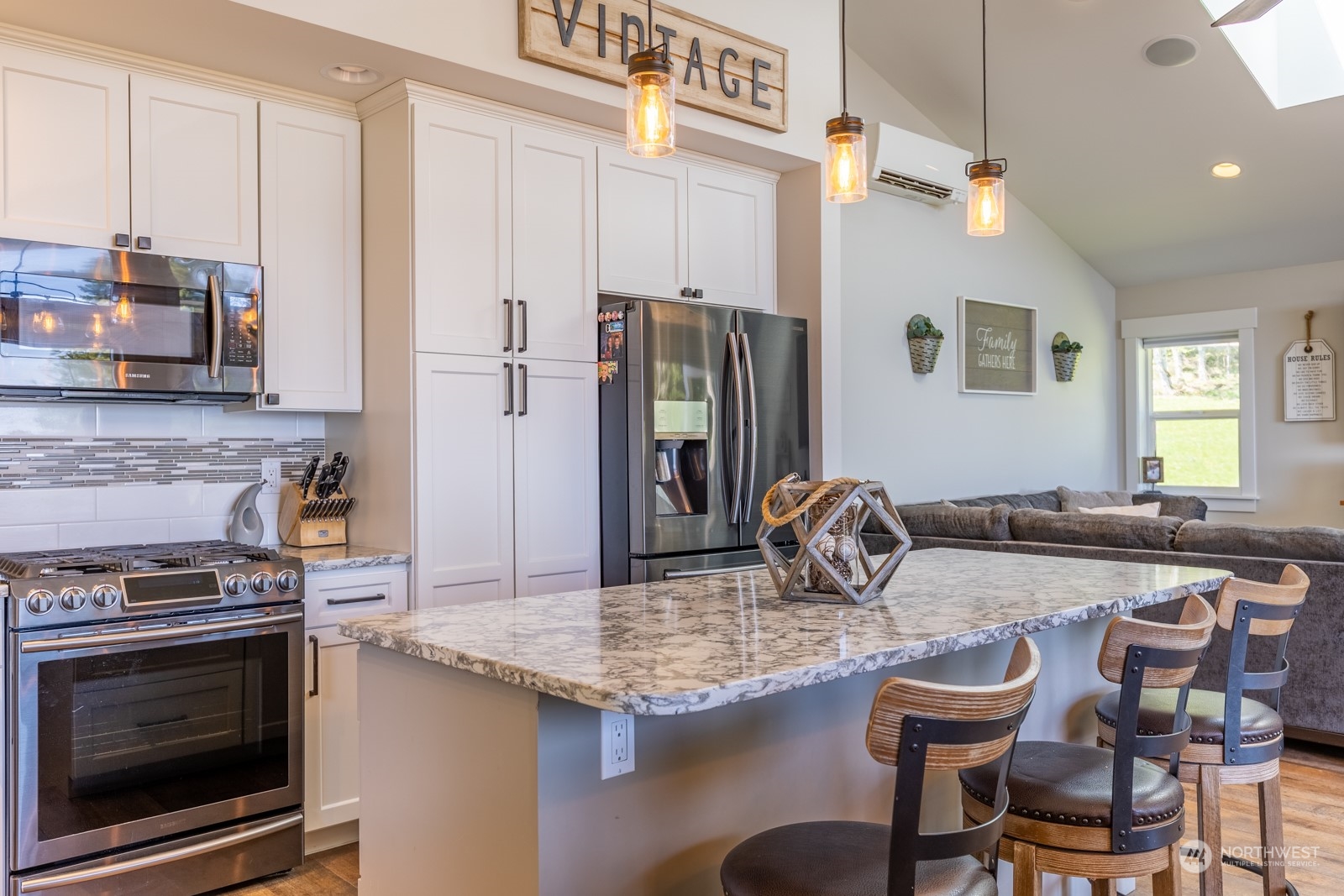 685 Misty Ridge Road Port Townsend, WA 98368 - Photo 21 of 39 a kitchen with granite countertop a stove and a refrigerator