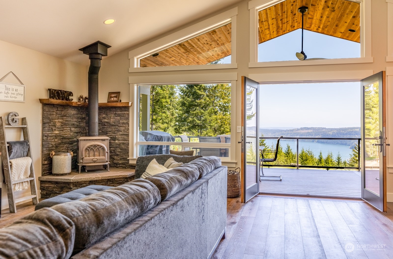 685 Misty Ridge Road Port Townsend, WA 98368 - Photo 22 of 39 a bedroom with furniture and large window