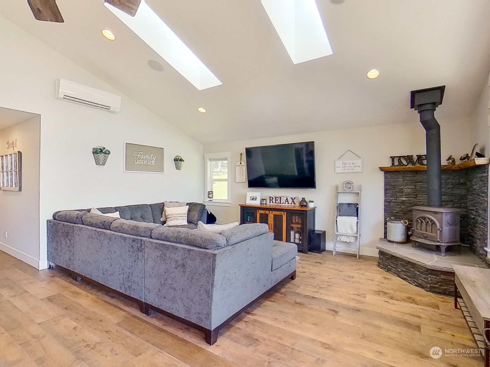 685 Misty Ridge Road Port Townsend, WA 98368 - Photo 23 of 39 a living room with furniture and a flat screen tv