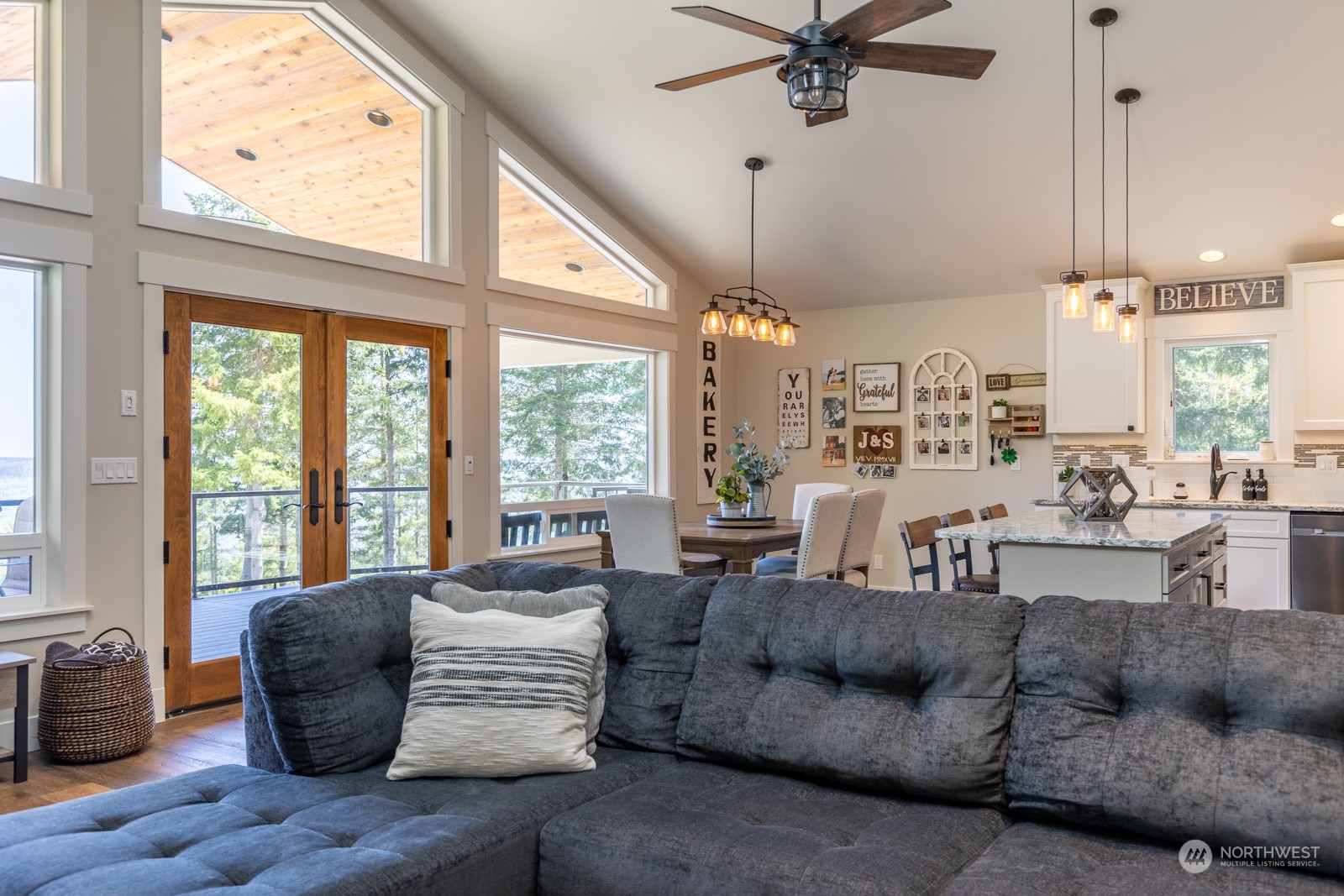 685 Misty Ridge Road Port Townsend, WA 98368 - Photo 24 of 39 a living room with furniture and a large window