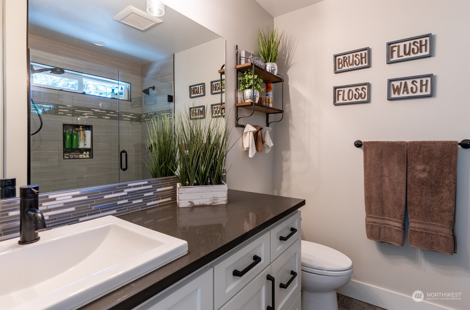 685 Misty Ridge Road Port Townsend, WA 98368 - Photo 29 of 39 a bathroom with a sink a toilet and shower