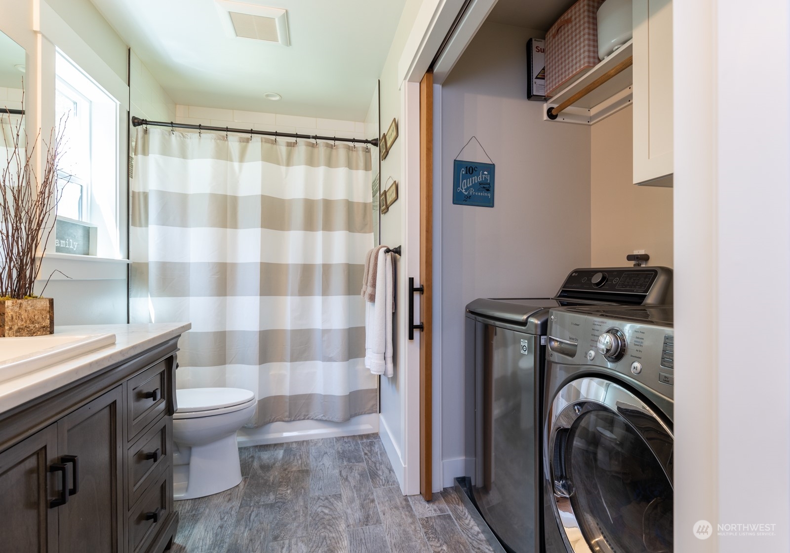 685 Misty Ridge Road Port Townsend, WA 98368 - Photo 30 of 39 a view of a bathroom with a sink a washer and dryer