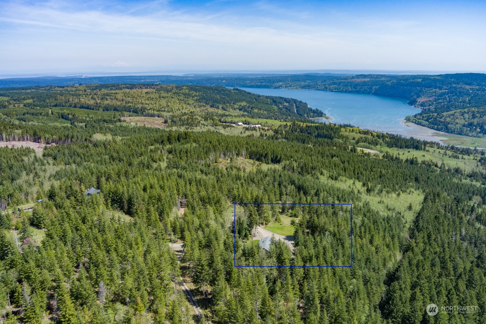 685 Misty Ridge Road Port Townsend, WA 98368 - Photo 3 of 39 a view of a field with an ocean