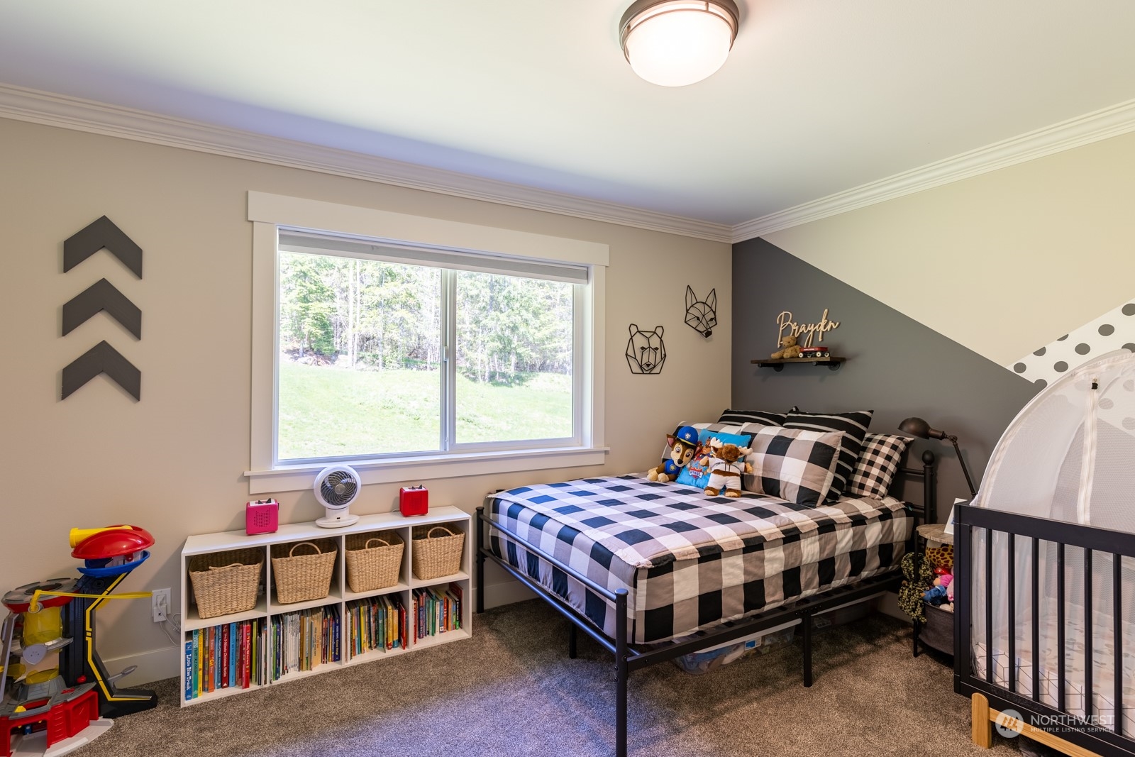 685 Misty Ridge Road Port Townsend, WA 98368 - Photo 31 of 39 a bedroom with a bed and a window