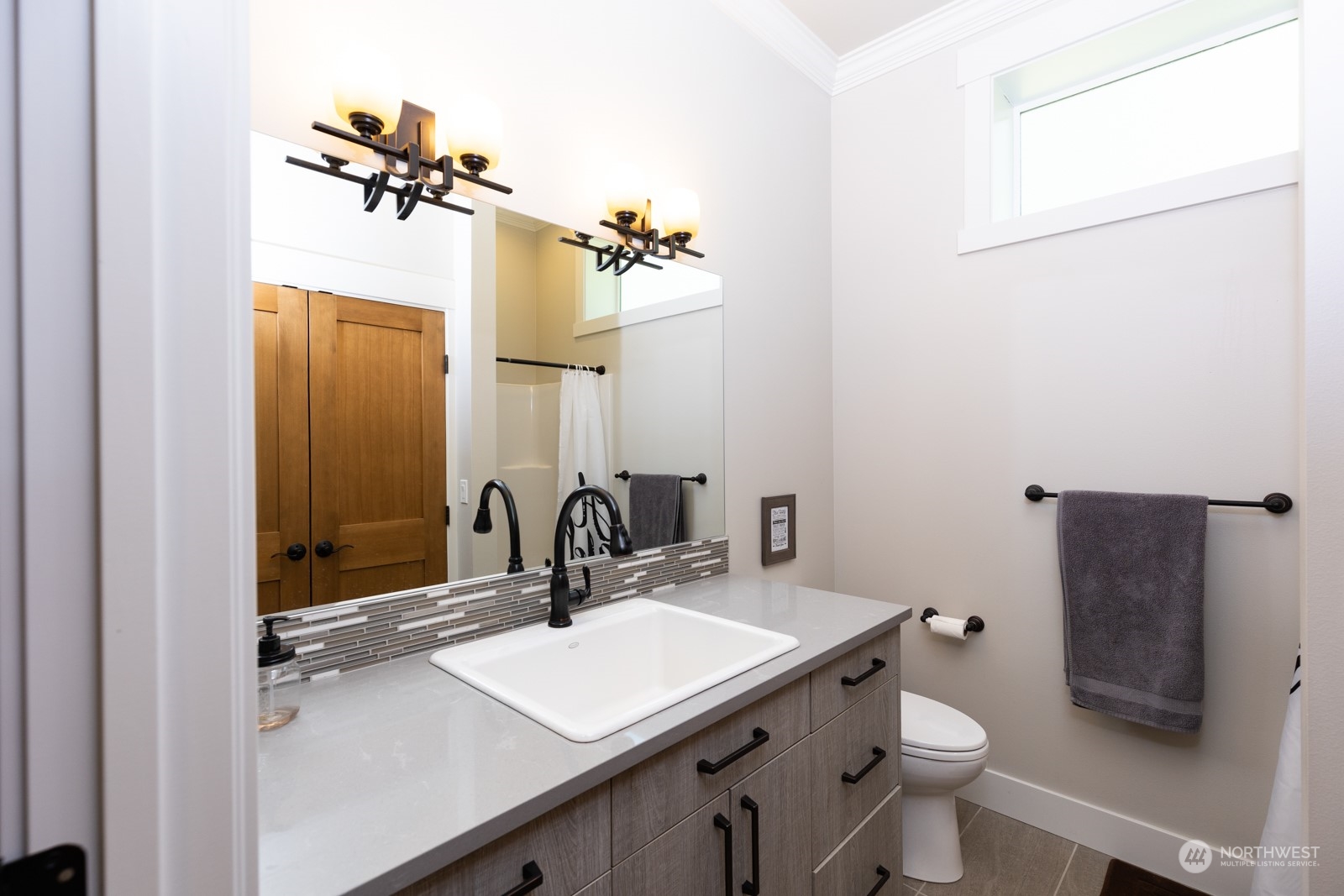 685 Misty Ridge Road Port Townsend, WA 98368 - Photo 34 of 39 a bathroom with a sink toilet and mirror
