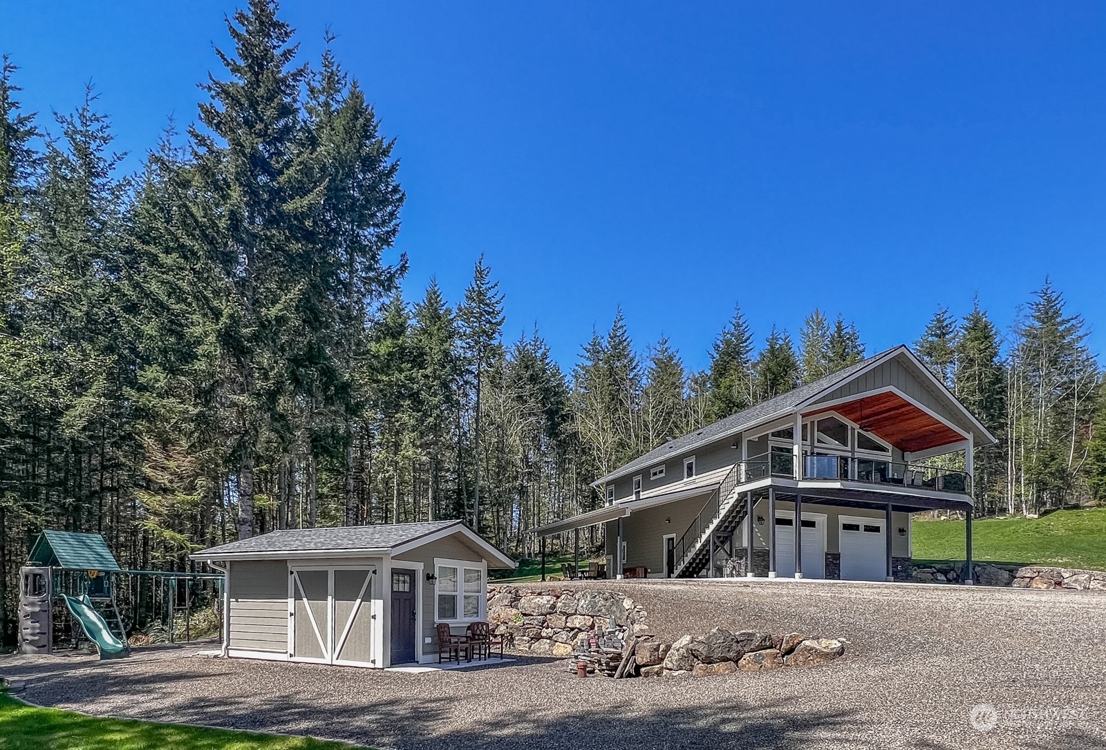 685 Misty Ridge Road Port Townsend, WA 98368 - Photo 7 of 39 a front view of a house with a yard