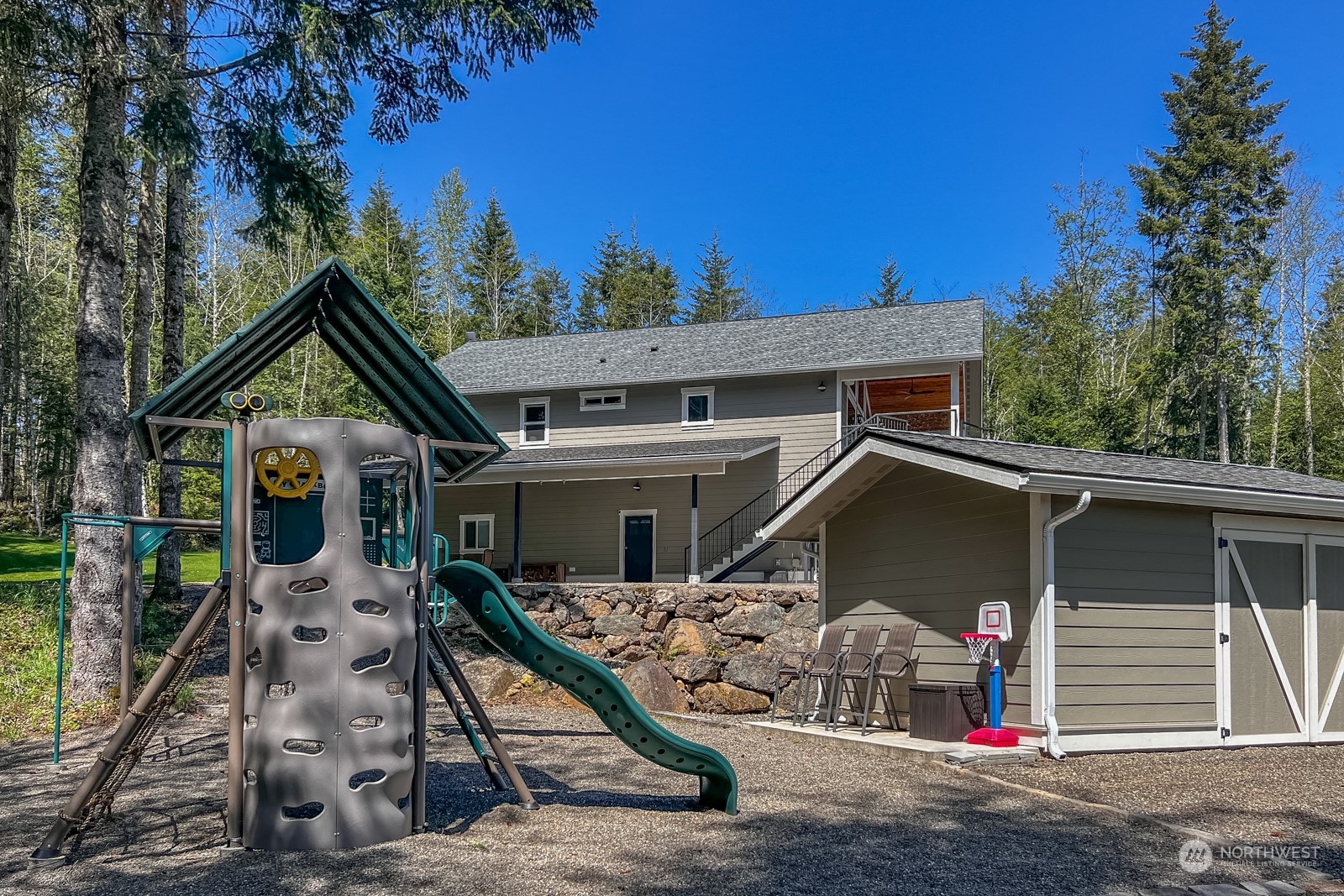 685 Misty Ridge Road Port Townsend, WA 98368 - Photo 9 of 39 a view of a house with a patio
