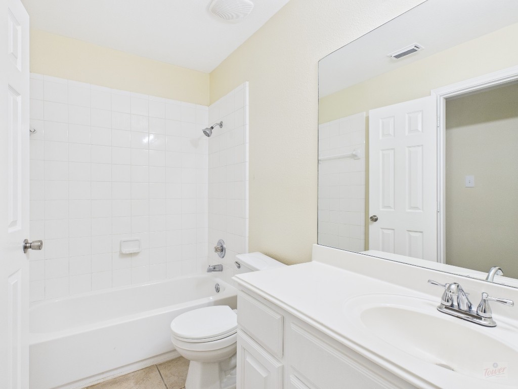 136 Winter Street Kyle, TX 78640 - Photo 17 of 32 a bathroom with a sink a toilet and shower