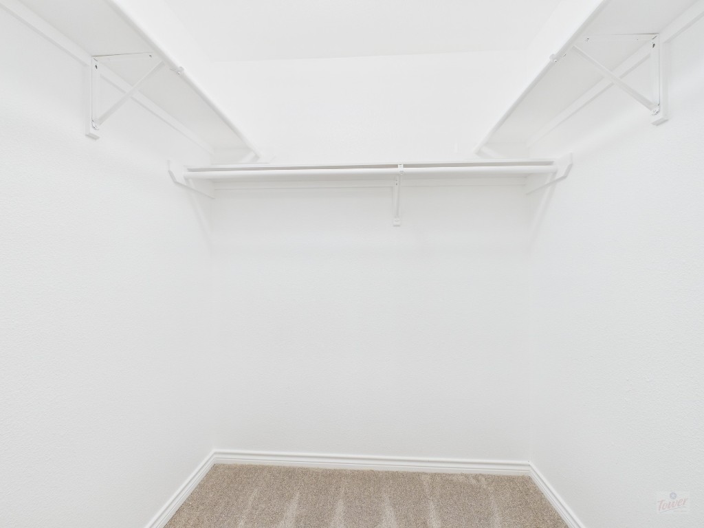 136 Winter Street Kyle, TX 78640 - Photo 19 of 32 a view of small space with racks on the wall