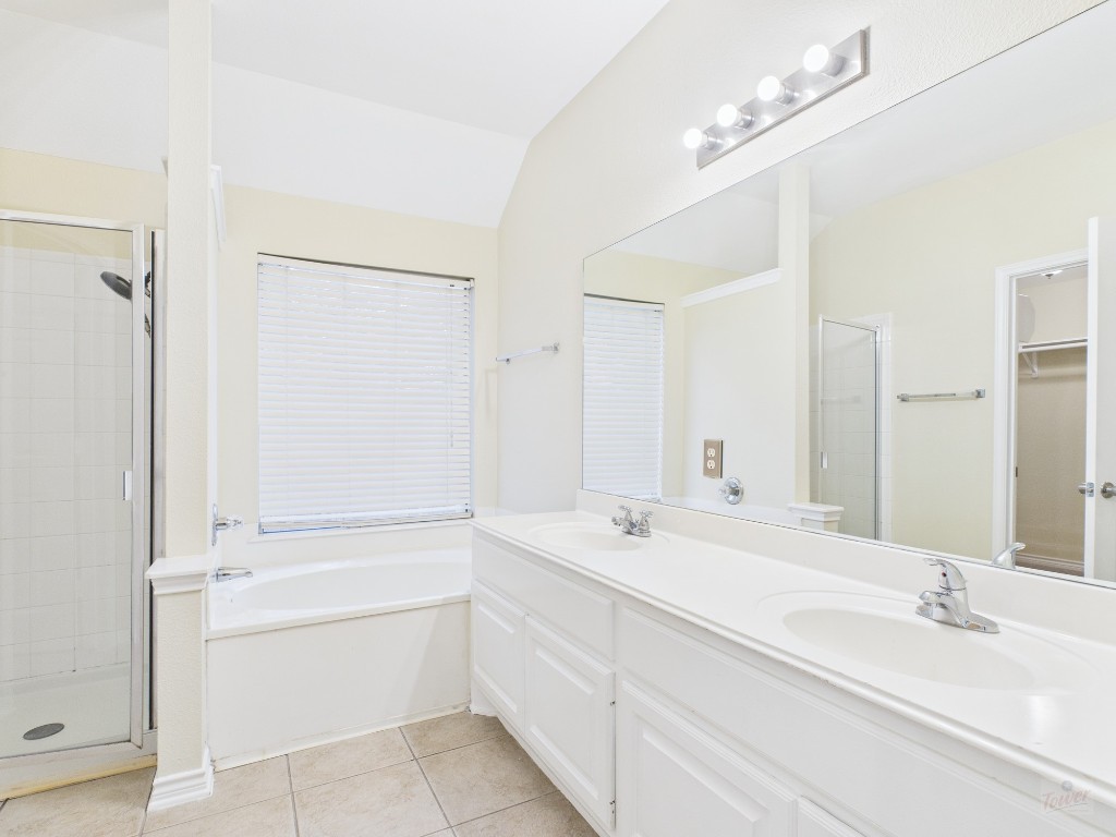 136 Winter Street Kyle, TX 78640 - Photo 21 of 32 a bathroom with a sink a double vanity and a mirror