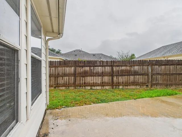 a view of a garden with a small cabin