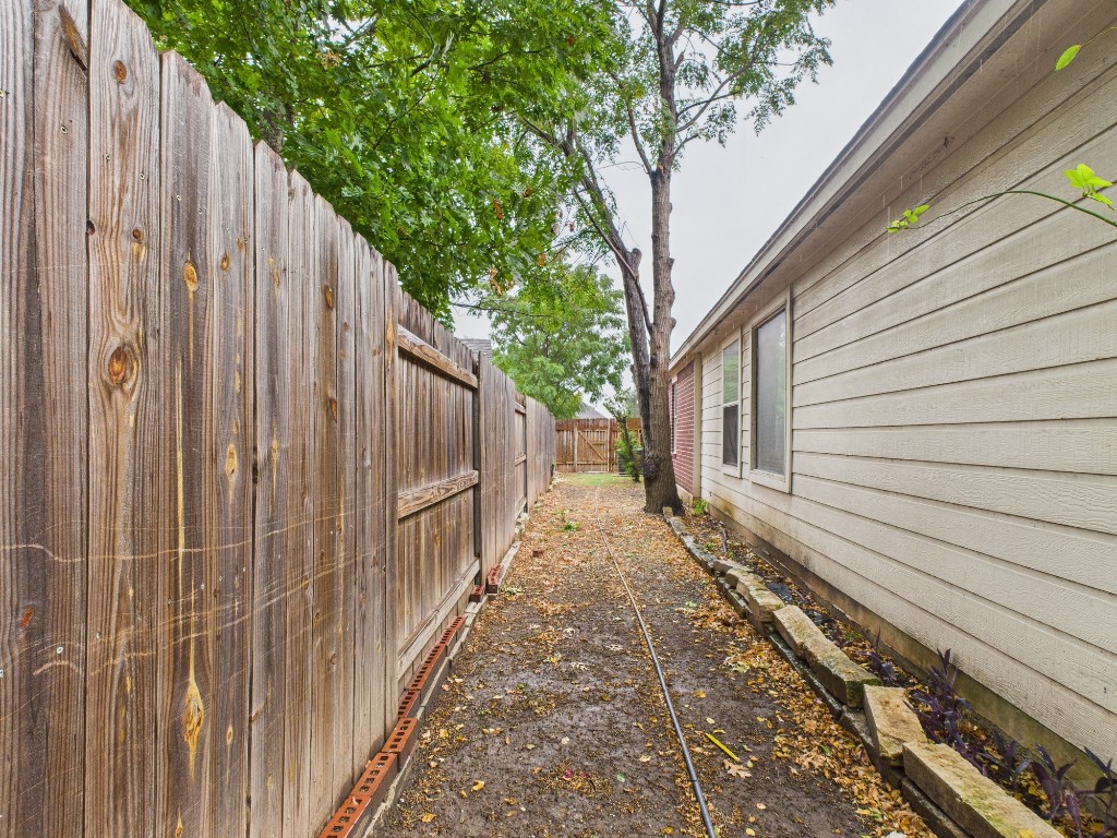 136 Winter Street Kyle, TX 78640 - Photo 29 of 32 a view of a backyard with pathway