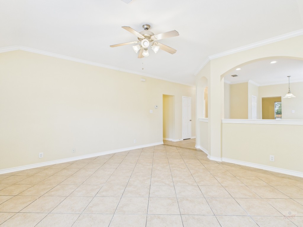 136 Winter Street Kyle, TX 78640 - Photo 5 of 32 an empty room with fan and ceiling fan