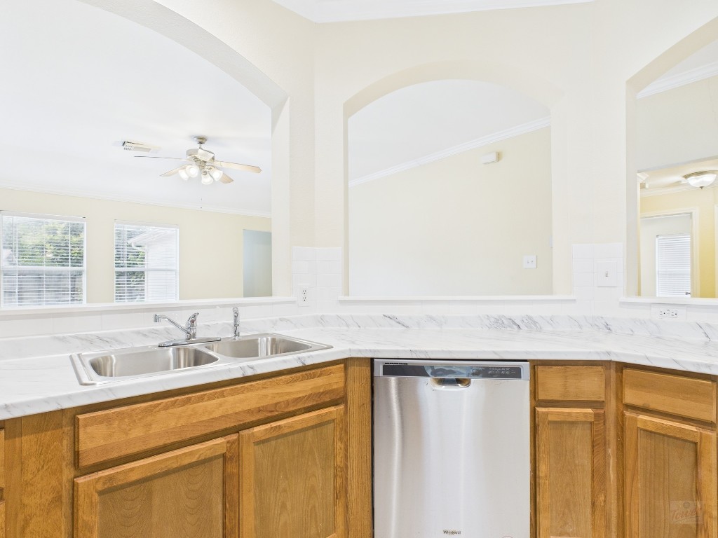 136 Winter Street Kyle, TX 78640 - Photo 7 of 32 a bathroom with a granite countertop sink and a mirror