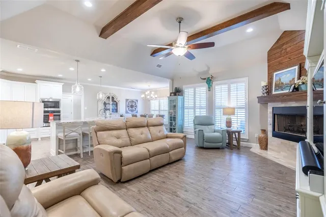 a kitchen with kitchen island granite countertop a table and chairs in it