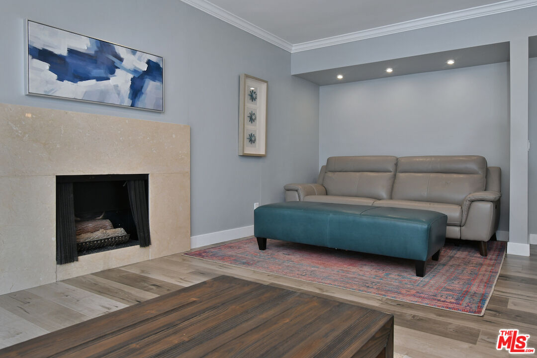 2345 Roscomare Road, Unit 205 Los Angeles, CA 90077 - Photo 12 of 50 a bedroom with a bed and a fireplace