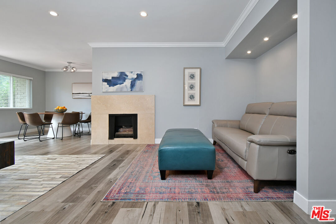 2345 Roscomare Road, Unit 205 Los Angeles, CA 90077 - Photo 13 of 50 a living room with furniture and a fireplace