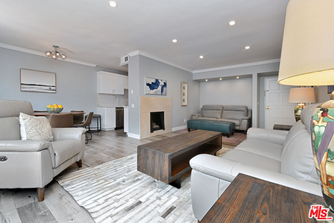 2345 Roscomare Road, Unit 205 Los Angeles, CA 90077 - Photo 15 of 50 a living room with furniture and a fireplace