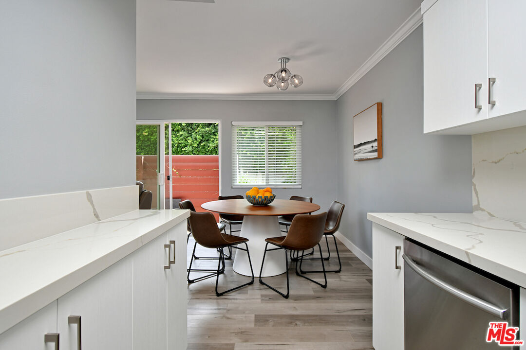 2345 Roscomare Road, Unit 205 Los Angeles, CA 90077 - Photo 21 of 50 a view of a dining room that has a table and chairs in it