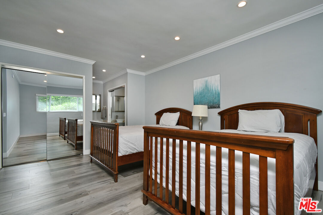 2345 Roscomare Road, Unit 205 Los Angeles, CA 90077 - Photo 26 of 50 a bedroom with furniture and wooden floor