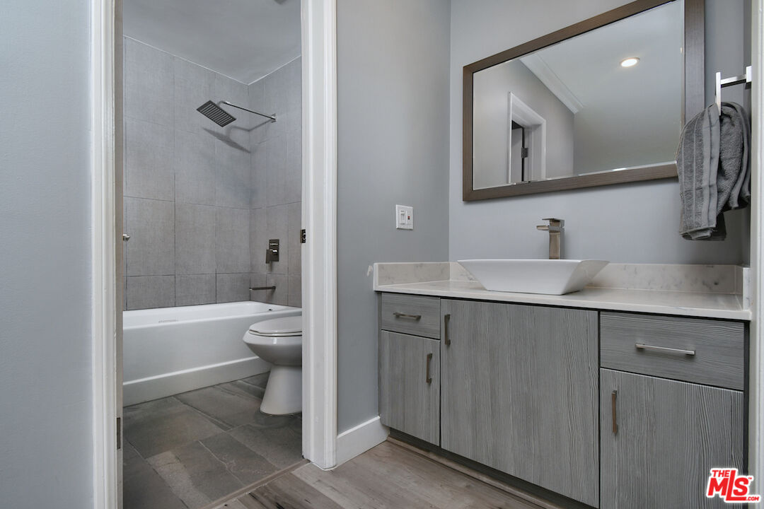2345 Roscomare Road, Unit 205 Los Angeles, CA 90077 - Photo 29 of 50 a bathroom with a sink a toilet and shower