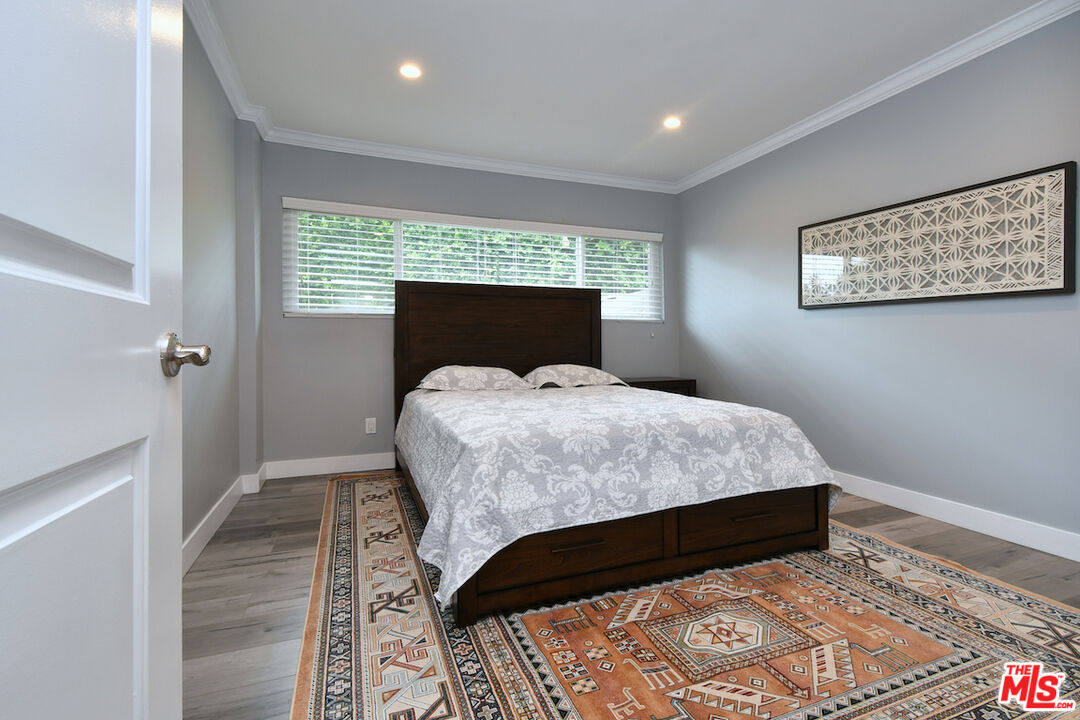 2345 Roscomare Road, Unit 205 Los Angeles, CA 90077 - Photo 31 of 50 a bedroom with a bed and a window