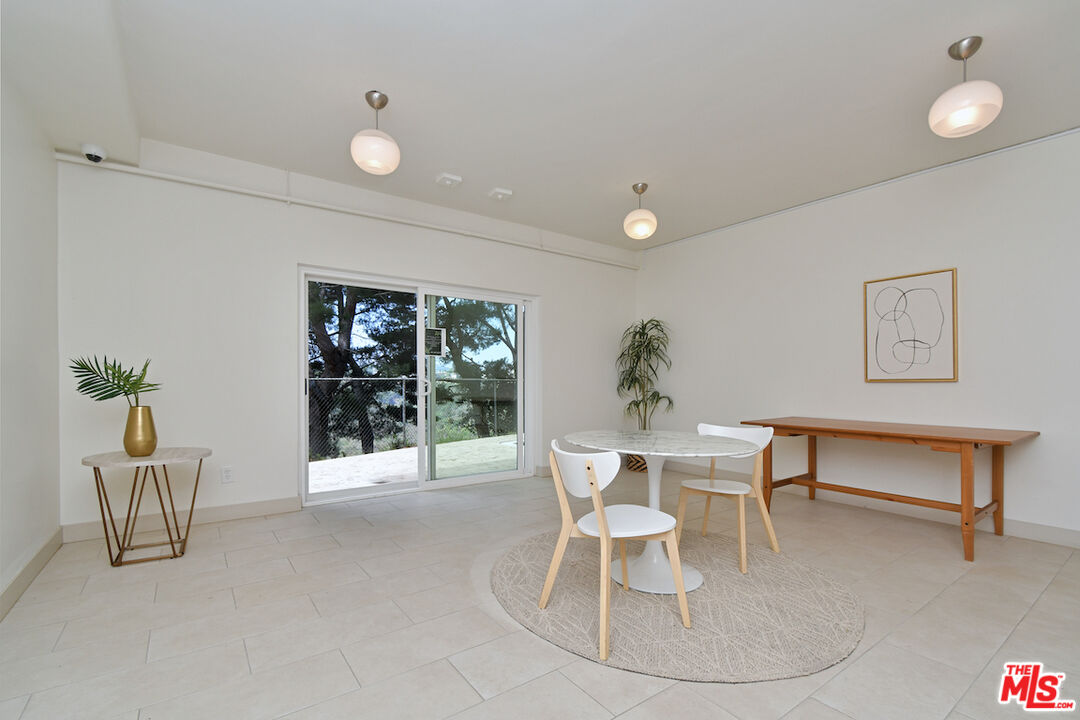 2345 Roscomare Road, Unit 205 Los Angeles, CA 90077 - Photo 38 of 50 a dining room with furniture and window