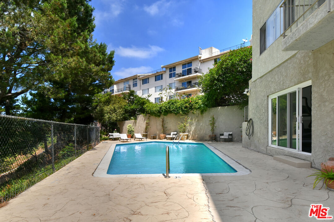 2345 Roscomare Road, Unit 205 Los Angeles, CA 90077 - Photo 39 of 50 a view of a swimming pool with a patio