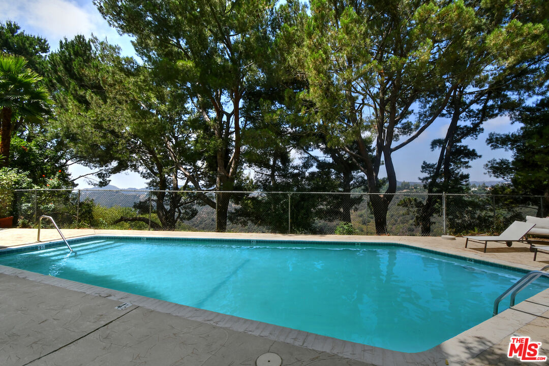 2345 Roscomare Road, Unit 205 Los Angeles, CA 90077 - Photo 40 of 50 a view of a swimming pool with a patio